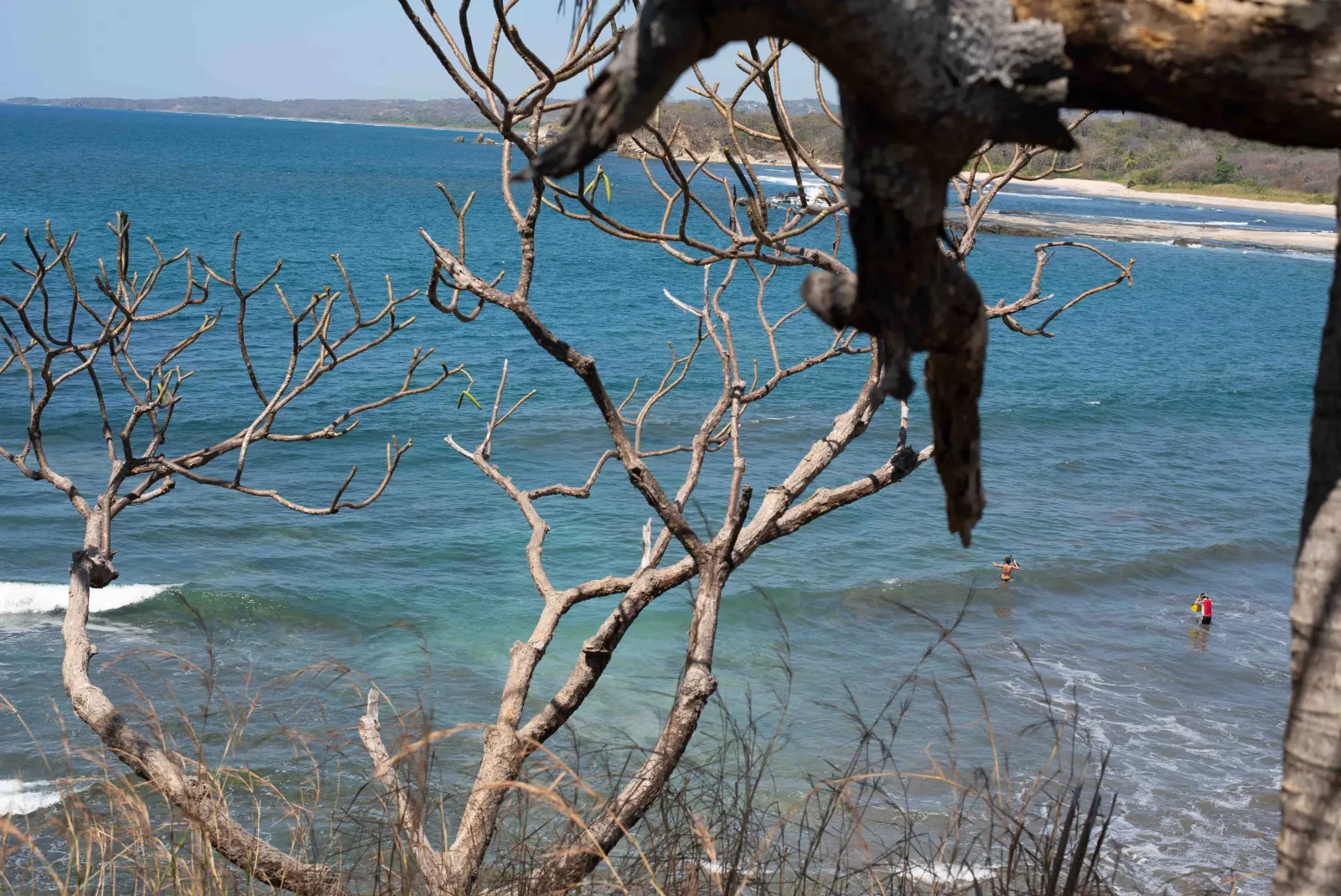 A rocky headland and calm shoreline at Manuel Antonio